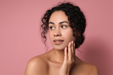 Photo of Cosmetology. Beautiful woman with perfect skin on pink background