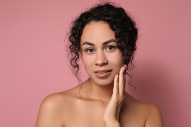 Photo of Cosmetology. Beautiful woman with perfect skin on pink background