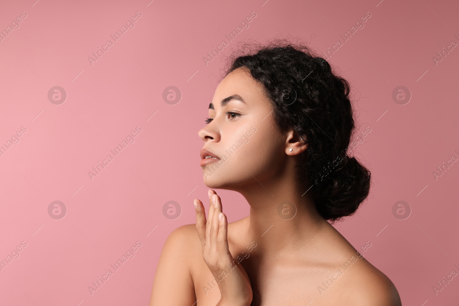 Photo of Cosmetology. Beautiful woman with perfect skin on pink background, space for text