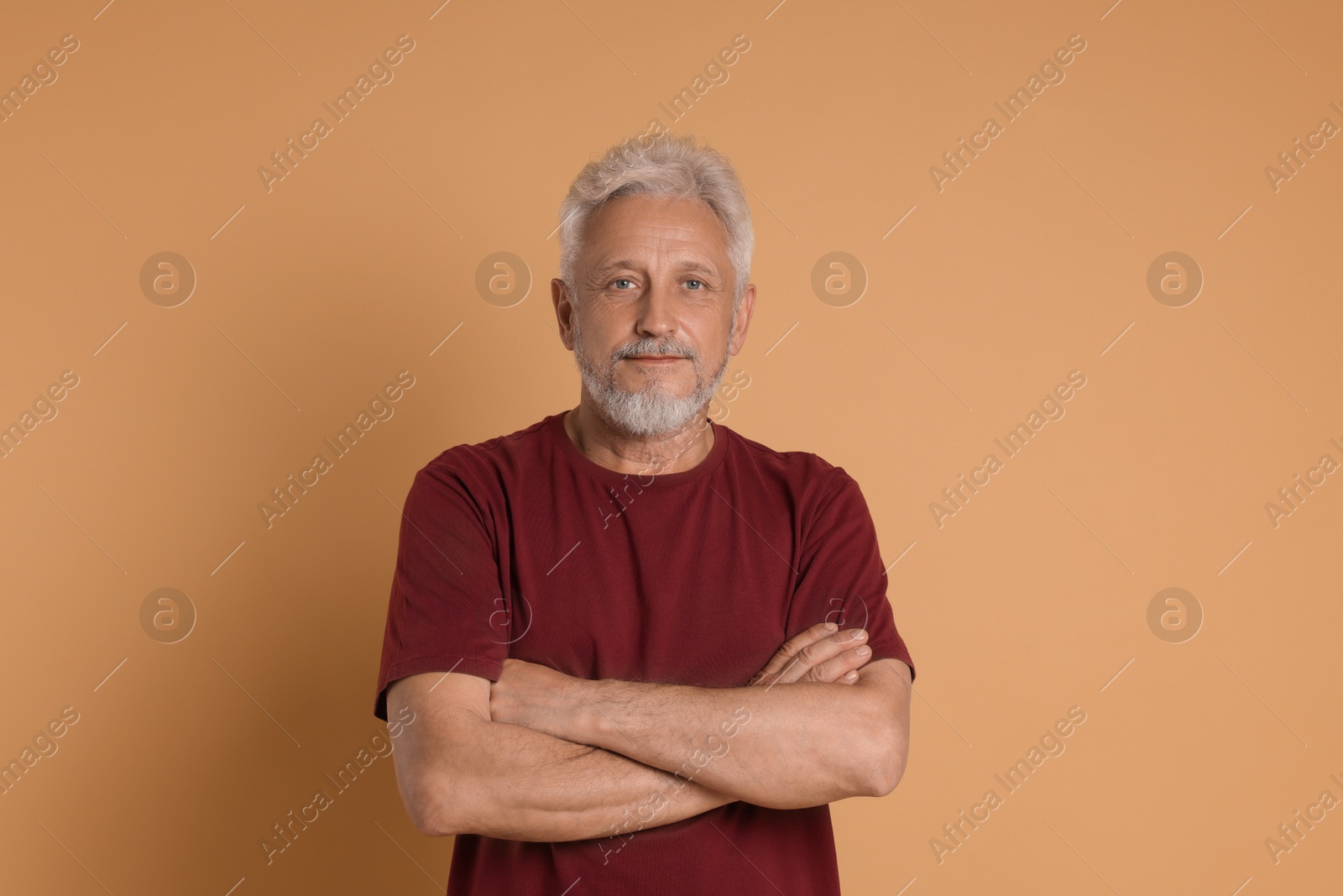 Photo of Portrait of senior man on beige background