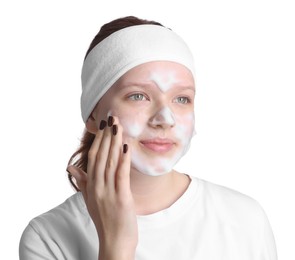 Photo of Teenage girl washing her face with cleanser on white background. Cosmetic product