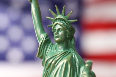 Photo of Statue of Liberty against flag of USA, closeup