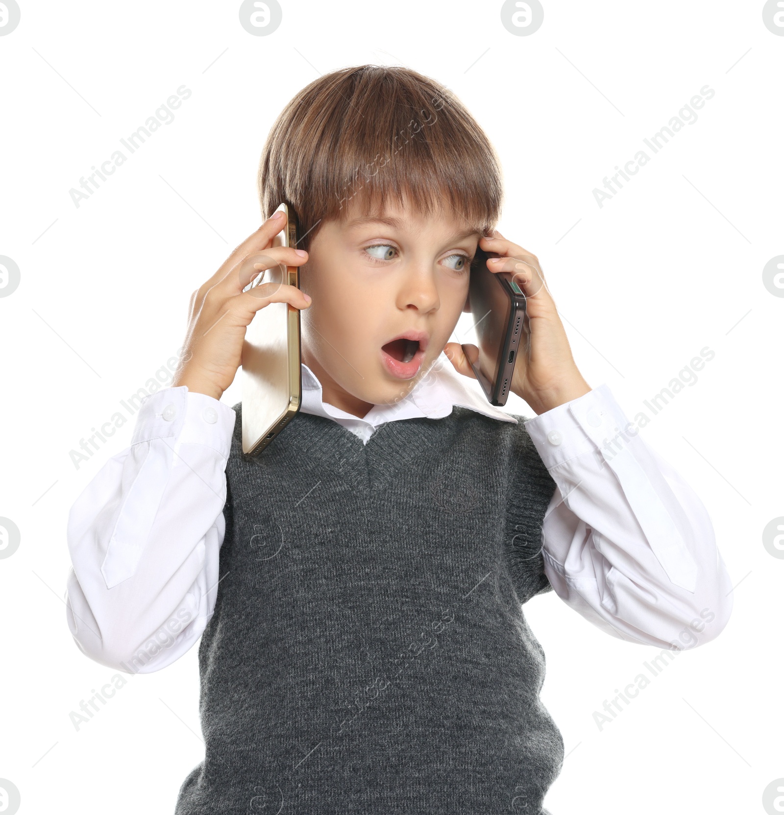 Photo of Little boy with smartphones on white background