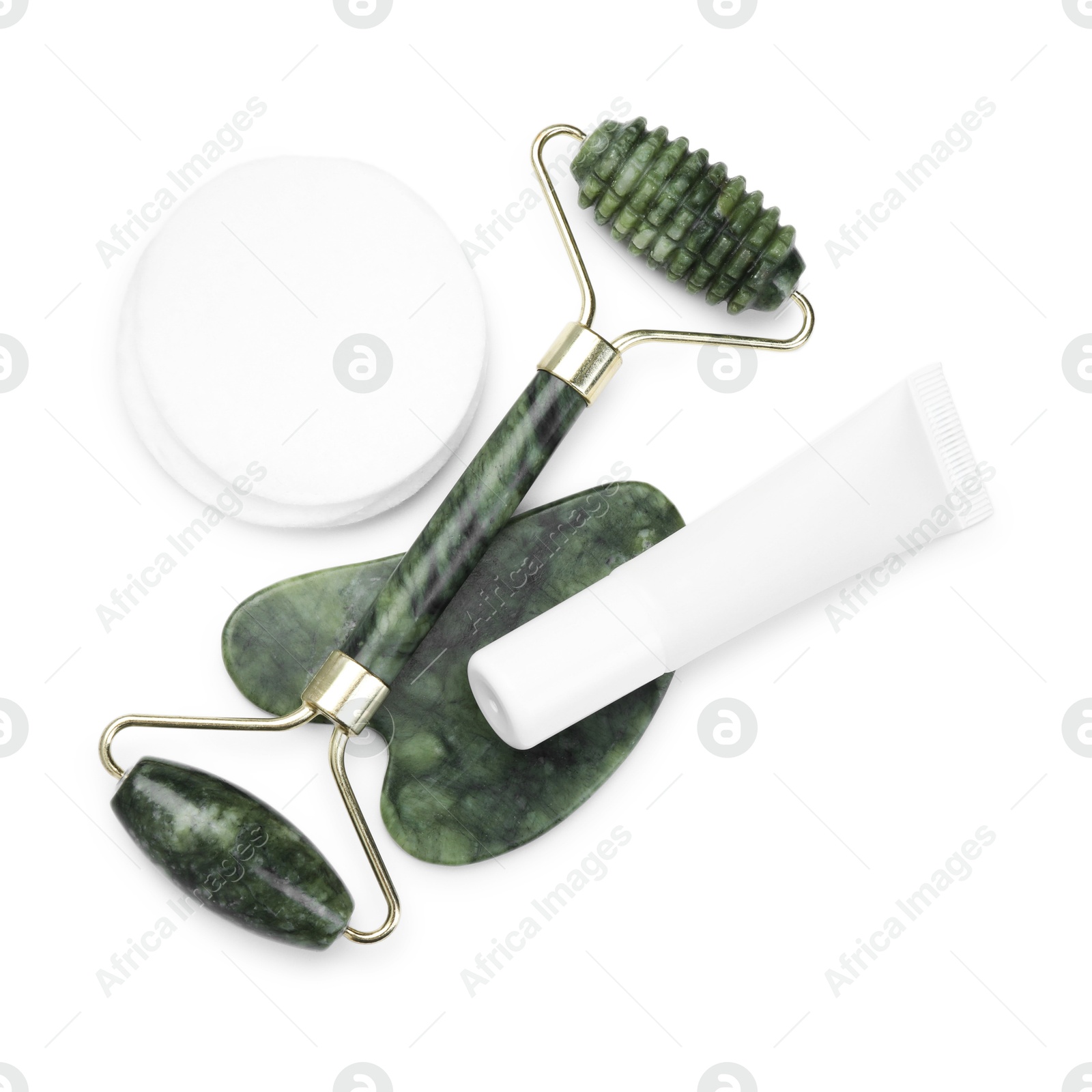 Photo of Face roller, cosmetic product and gua sha tool isolated on white, top view