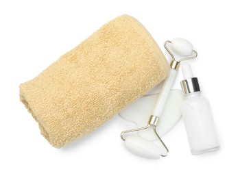 Photo of Face roller, gua sha tool, bottle and towel isolated on white, top view