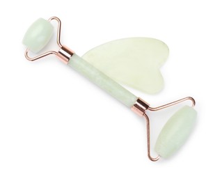 Photo of Face roller and gua sha tool isolated on white, top view