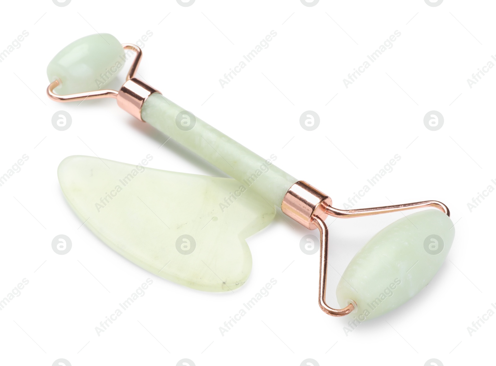 Photo of Face roller and gua sha tool isolated on white