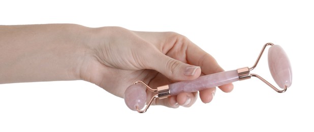 Photo of Woman holding face roller on white background, closeup