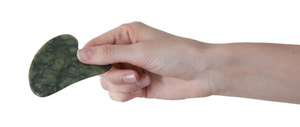 Photo of Woman holding gua sha tool on white background, closeup