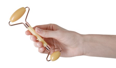 Woman holding face roller on white background, closeup