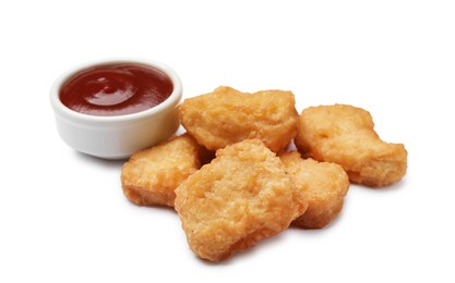 Delicious chicken nuggets with ketchup isolated on white