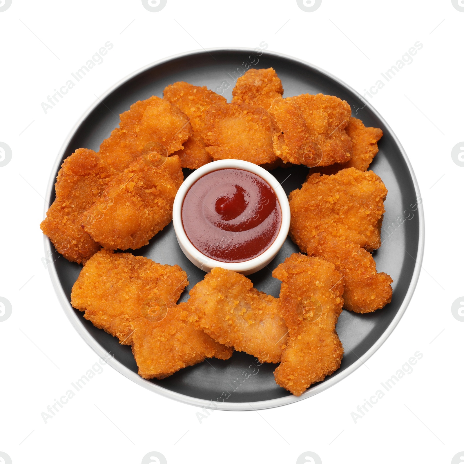 Photo of Delicious chicken nuggets with ketchup isolated on white, top view