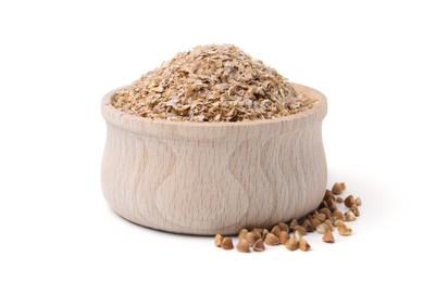 Photo of Buckwheat bran in wooden bowl and grains isolated on white