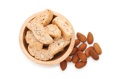 Photo of Traditional Italian almond biscuits (Cantucci) in bowl and nuts isolated on white, top view