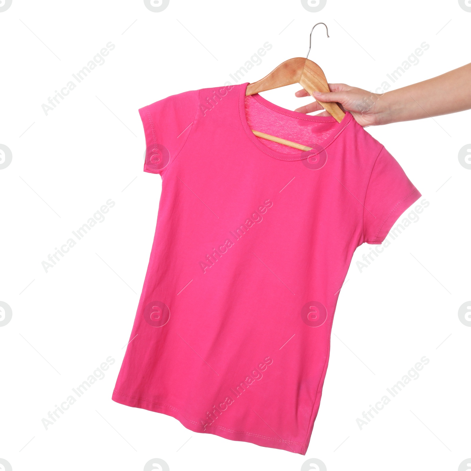 Photo of Woman holding hanger with beautiful t-shirt on white background, closeup