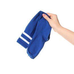 Photo of Woman holding pair of blue socks on white background, closeup