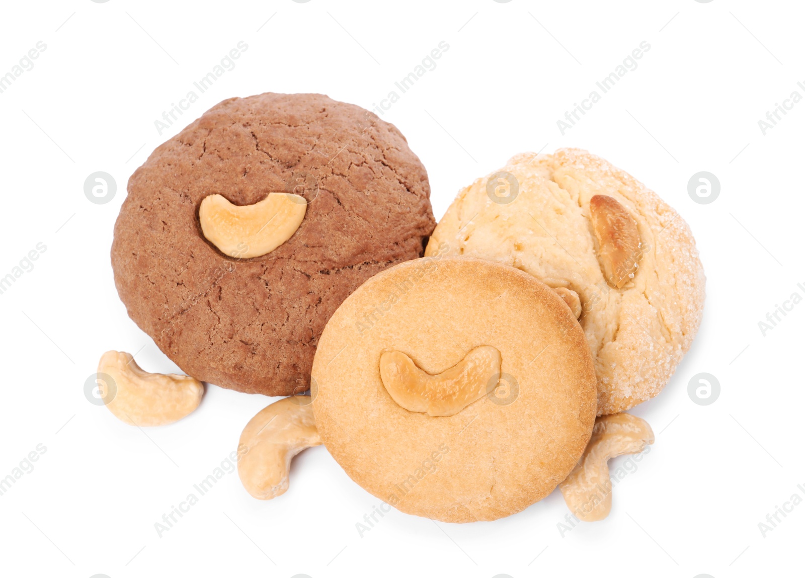 Photo of Different tasty cashew cookies isolated on white, above view