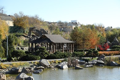 Photo of Terrace near lake in beautiful autumnal park