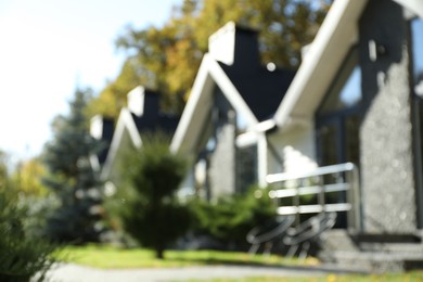 Blurred view of modern hotel buildings and different plants outdoors