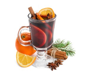 Photo of Tasty mulled wine, spices, orange and fir branches isolated on white. Christmas drink