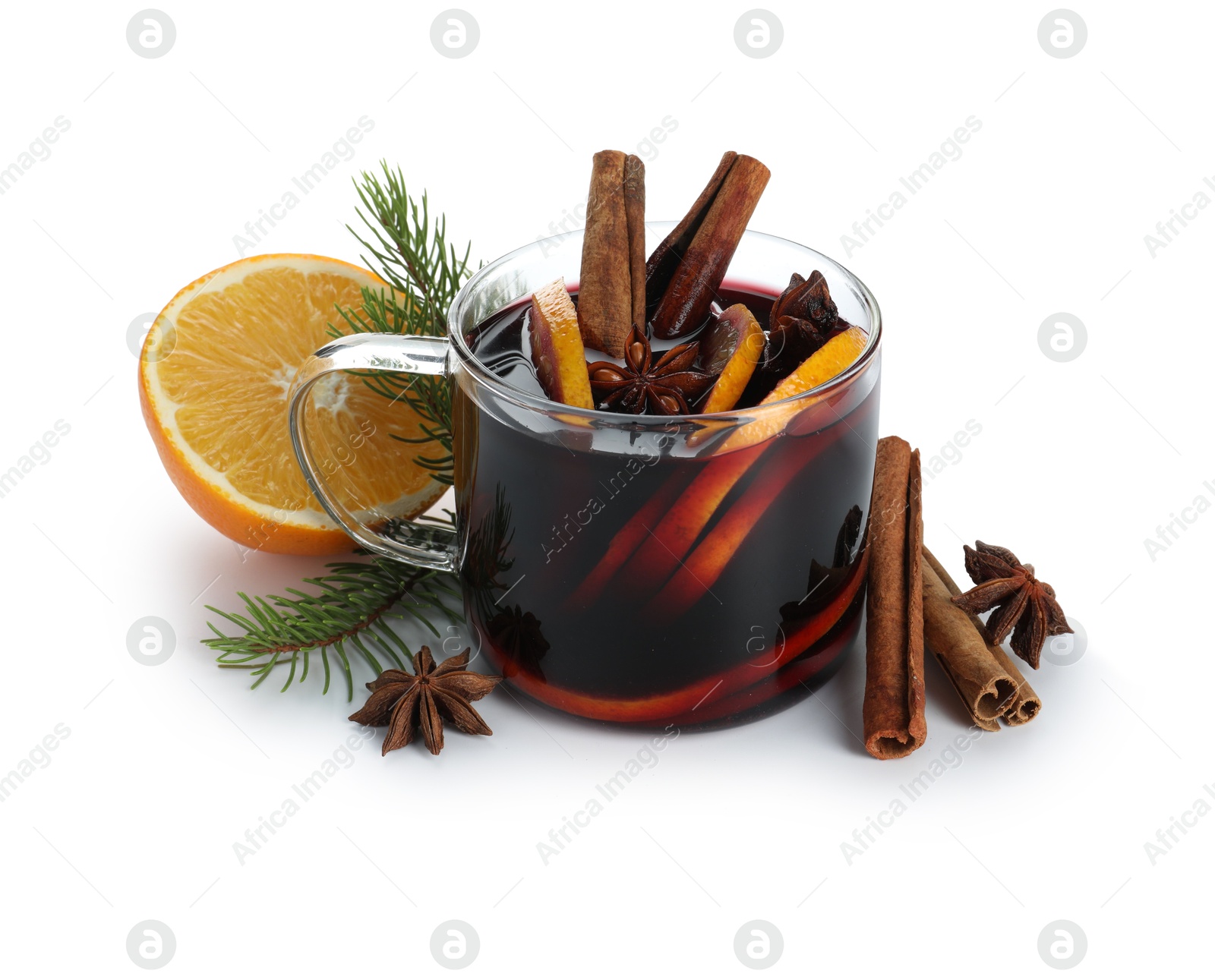 Photo of Tasty mulled wine, spices, orange and fir branches isolated on white. Christmas drink