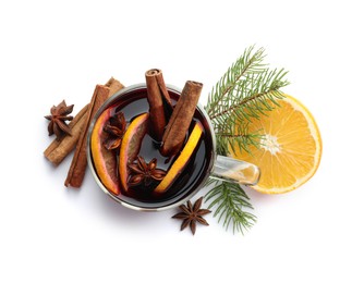 Photo of Tasty mulled wine, spices, orange slices and fir branches isolated on white, top view. Christmas drink