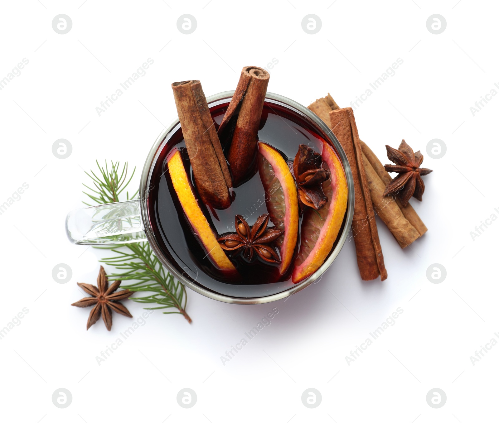 Photo of Tasty mulled wine, spices, orange slices and fir branches isolated on white, top view. Christmas drink