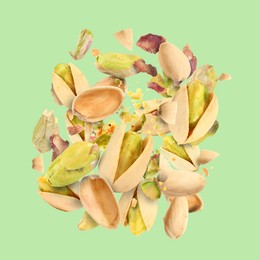 Image of Tasty pistachios with cracked nutshell in air on color background