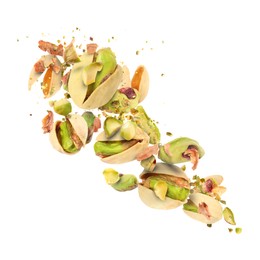 Image of Tasty pistachios with cracked nutshell in air on white background