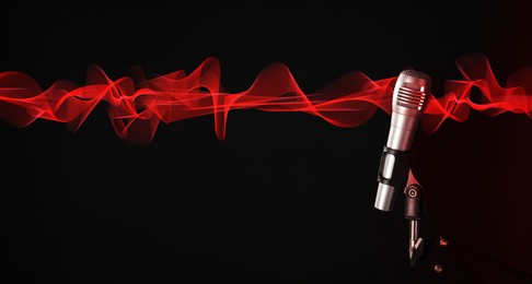 Image of Sound wave and microphone on black background. Banner design