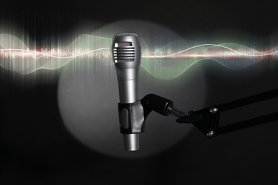 Illustration of Sound wave and microphone on black background with spotlight