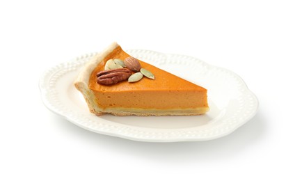 Photo of Piece of tasty homemade pumpkin pie with seeds and nuts isolated on white