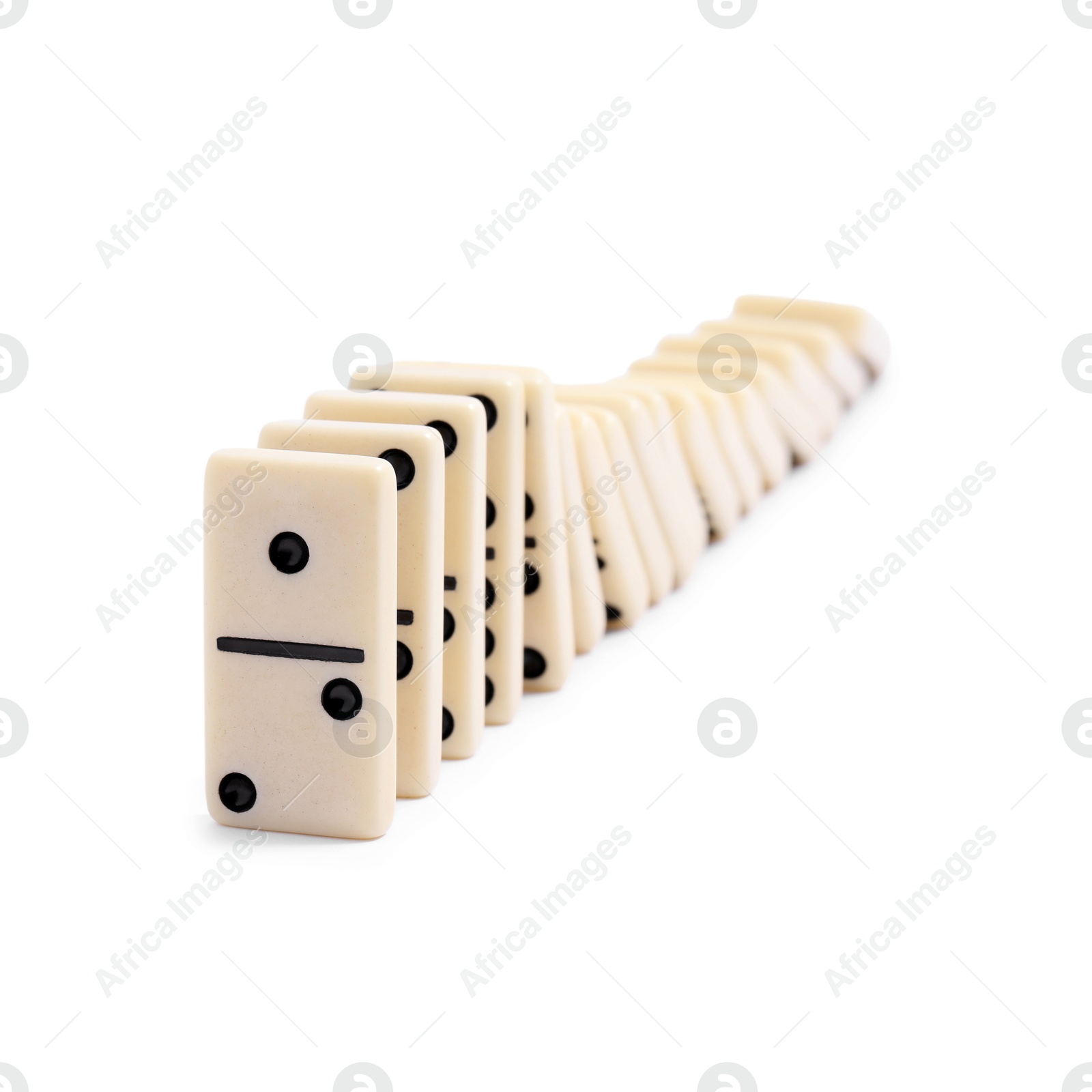 Photo of Domino effect. Tiles falling on white background