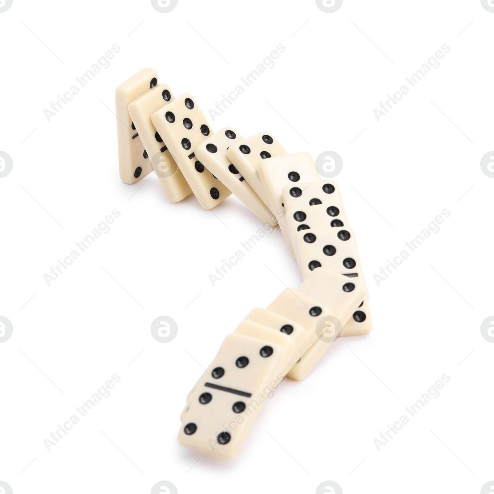 Photo of Domino effect. Tiles falling on white background