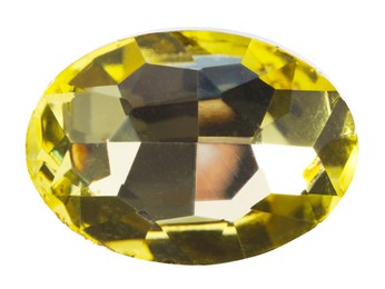 Photo of One yellow shiny gemstone isolated on white