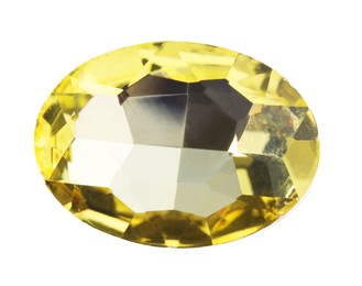 Photo of One yellow shiny gemstone isolated on white