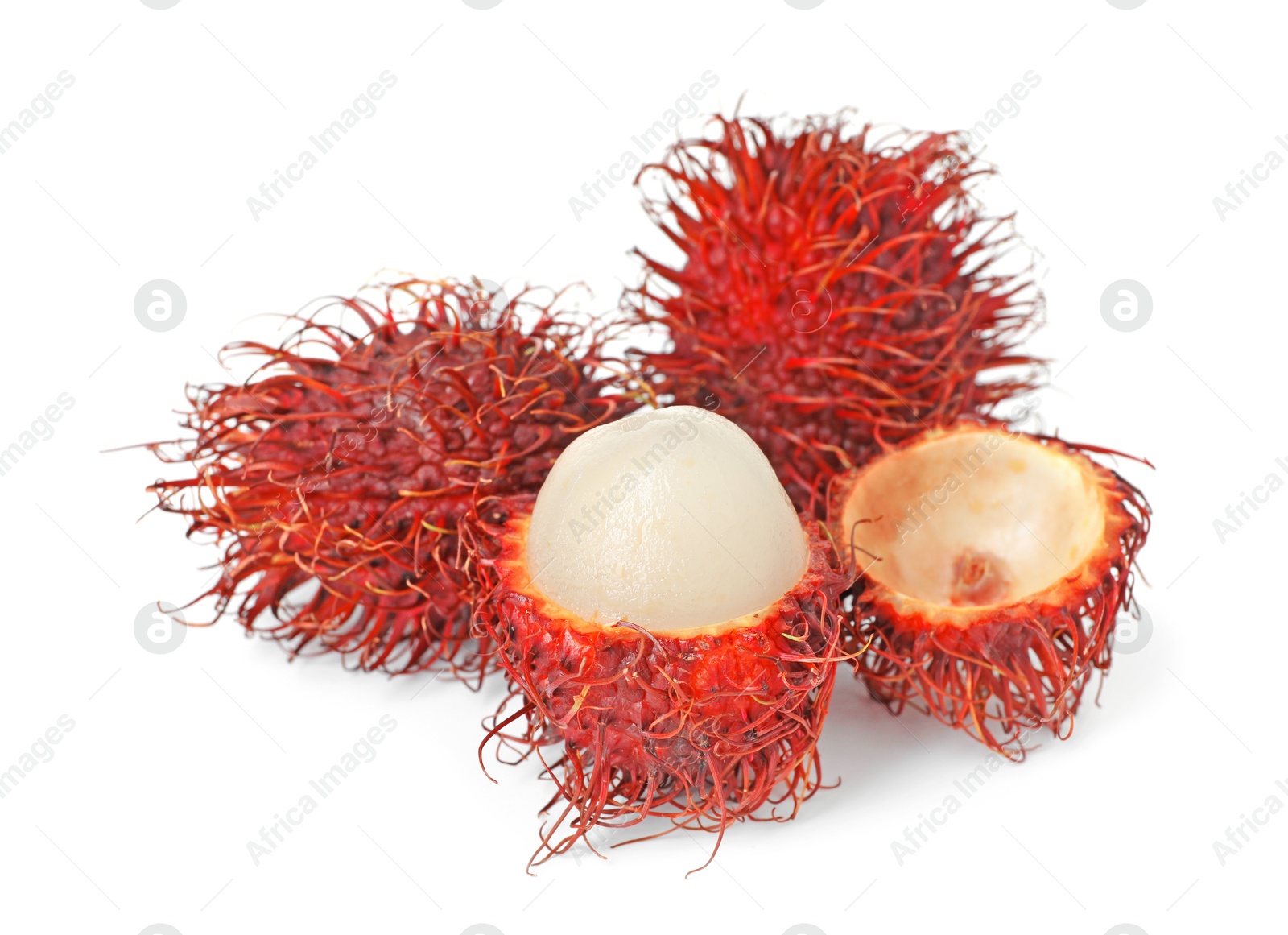 Photo of Delicious ripe rambutans isolated on white. Exotic fruit