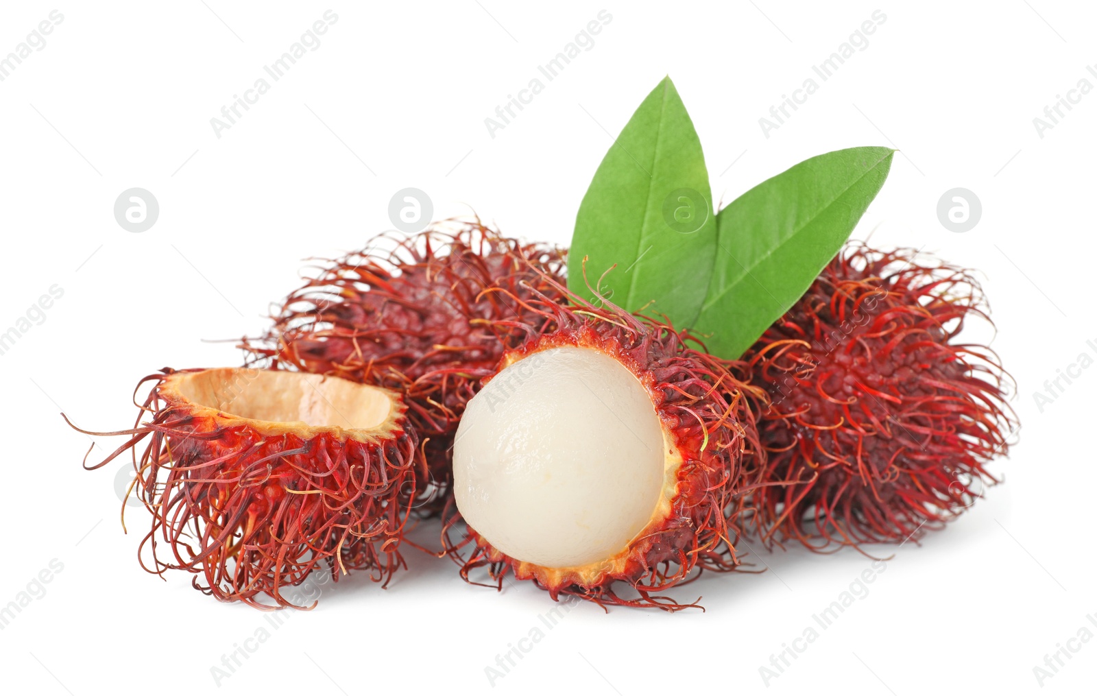 Photo of Delicious ripe rambutans and green leaves isolated on white. Exotic fruit