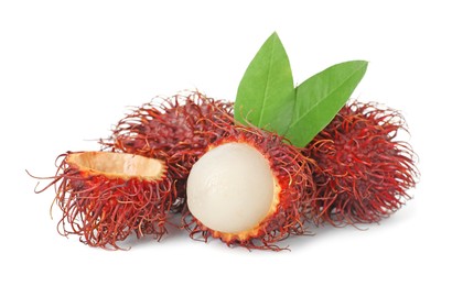 Delicious ripe rambutans and green leaves isolated on white. Exotic fruit