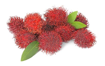 Photo of Delicious ripe rambutans and green leaves isolated on white. Exotic fruit