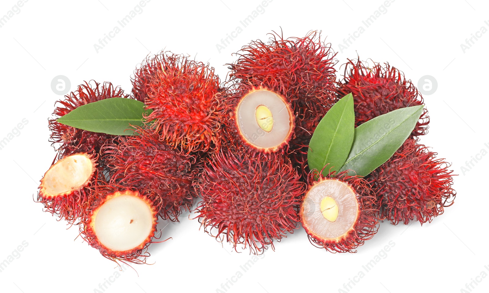 Photo of Delicious ripe rambutans and green leaves isolated on white. Exotic fruit