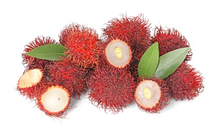 Delicious ripe rambutans and green leaves isolated on white. Exotic fruit