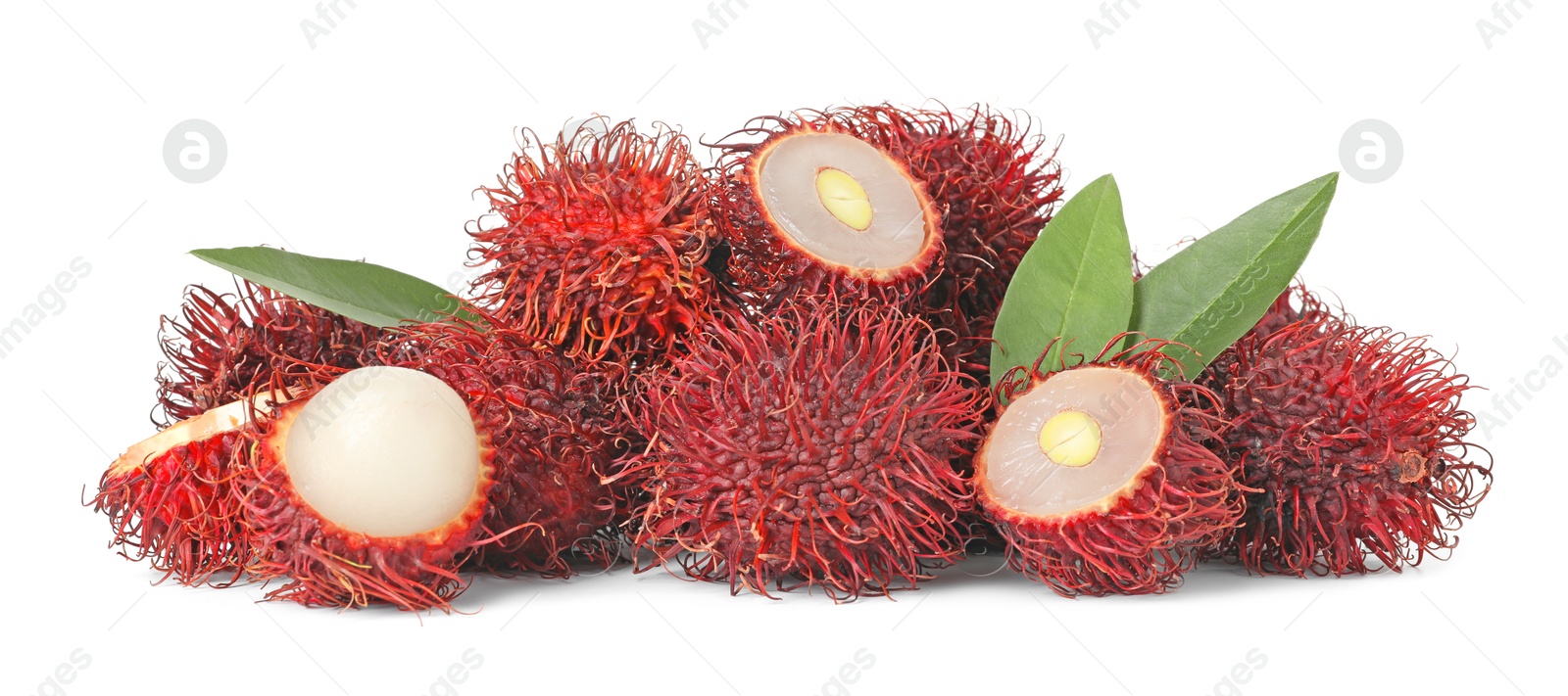 Photo of Delicious ripe rambutans and green leaves isolated on white. Exotic fruit