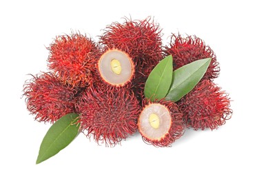 Photo of Delicious ripe rambutans and green leaves isolated on white. Exotic fruit