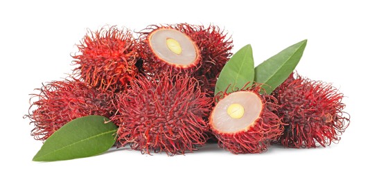 Delicious ripe rambutans and green leaves isolated on white. Exotic fruit