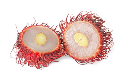 Photo of Halves of ripe rambutan isolated on white. Exotic fruit