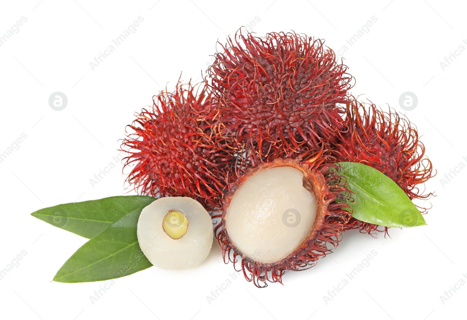 Photo of Delicious ripe rambutans and green leaves isolated on white. Exotic fruit