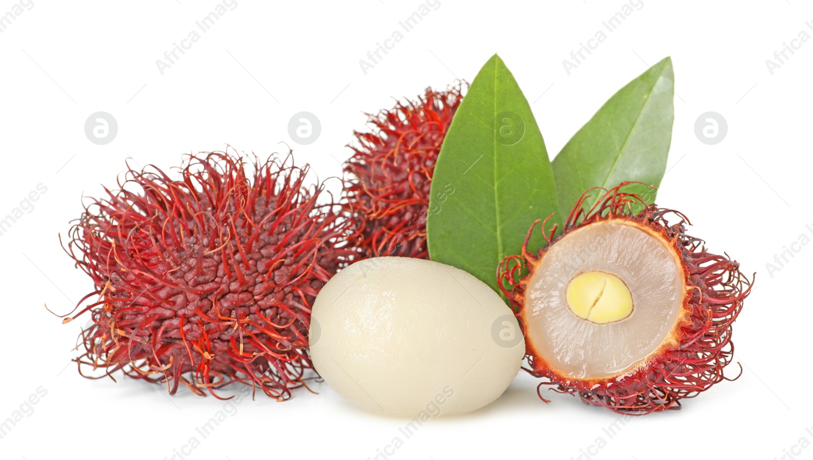 Photo of Delicious ripe rambutans and green leaves isolated on white. Exotic fruit