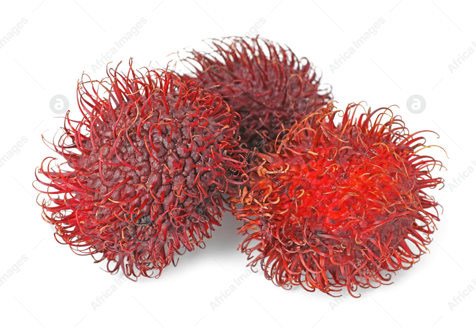 Photo of Delicious ripe rambutans isolated on white. Exotic fruit