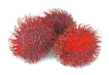 Photo of Delicious ripe rambutans isolated on white. Exotic fruit